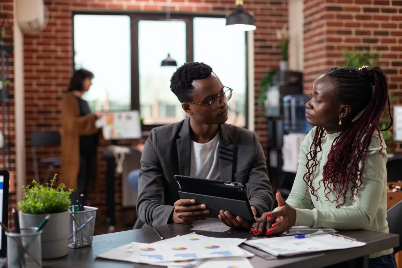 Executive Managers Analyzing Marketing Statistics | AR Webcrafts